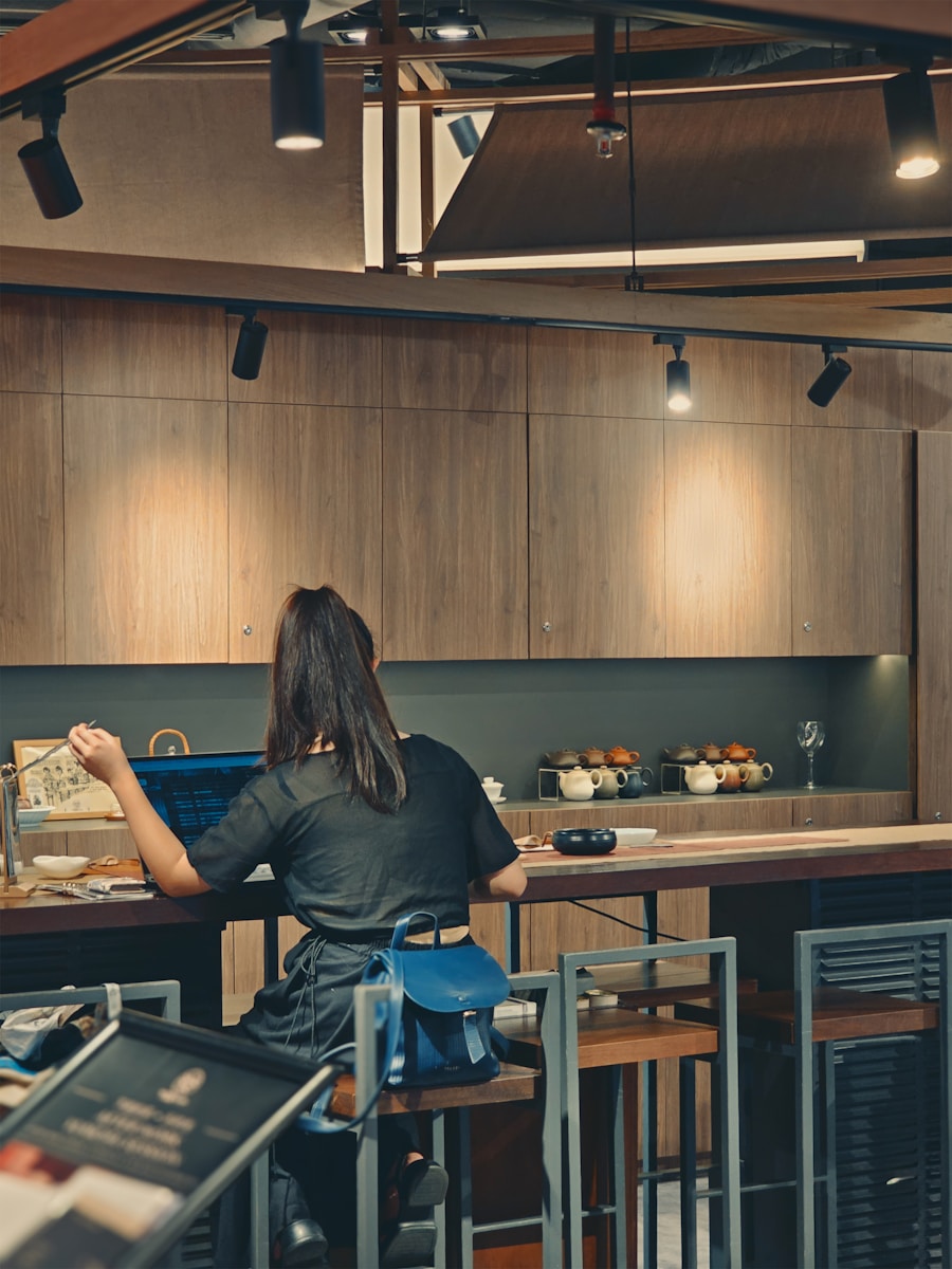 A person sitting at a table in a kitchen